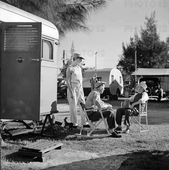 Three Men having Conversation at Trailer Park