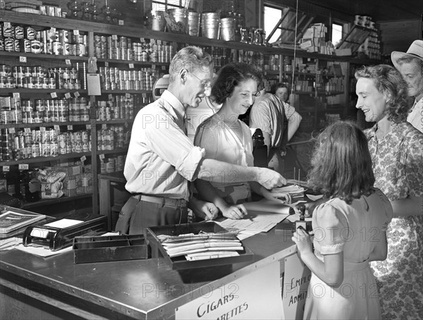 Customer receiving Change from Clerk after shopping at Cooperative Store