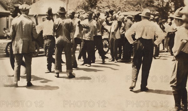 Detained African American men with Hands raised