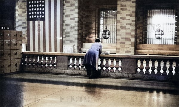 Rear View of Man looking over Balustrade