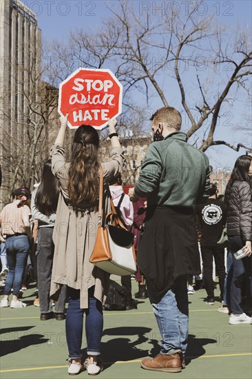 Couple with "Stop Asian Hate" Sign at Anti-Asian Violence Rally
