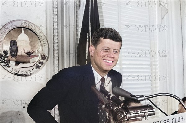 U.S. Senator John F. Kennedy speaking at lectern at National Press Club