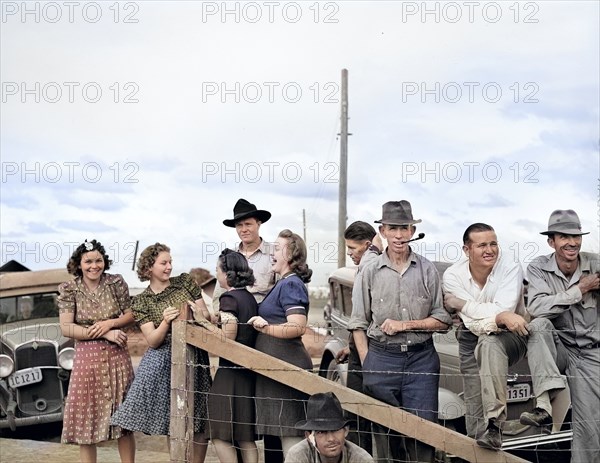 Group of people watching a Sunday afternoon baseball game