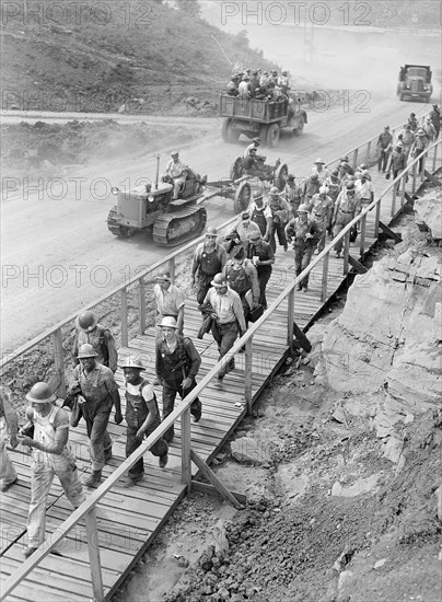 Worker's changing shifts during construction of Douglas Dam