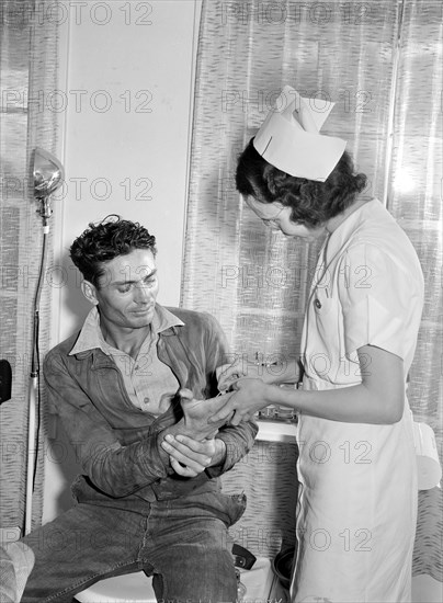 Patient receiving medical aid in health clinic