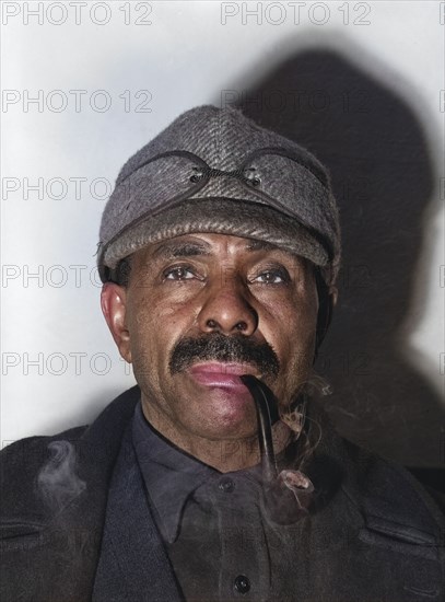 Unemployed coal miner smoking a pipe