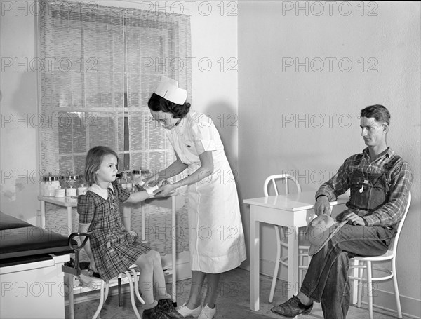 Patient receiving medical aid in health clinic