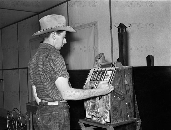 Cowboy playing slot machine