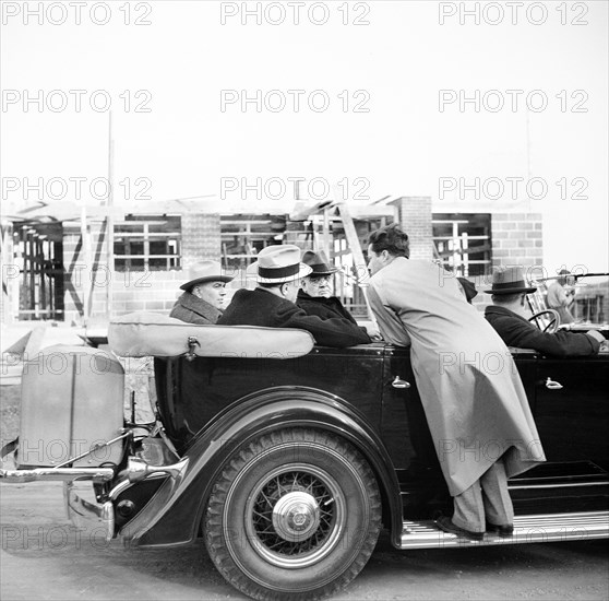 U.S. President Franklin Roosevelt touring construction of planned greenbelt community built by Federal Government