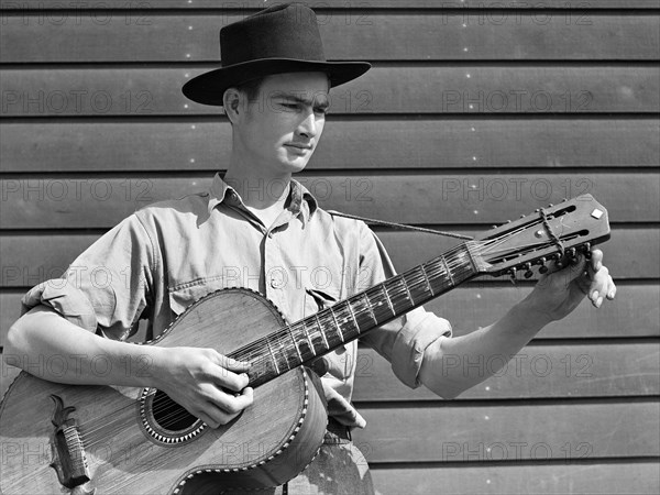 Young man playing acoustic guitar