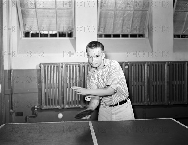 Boy playing ping pong