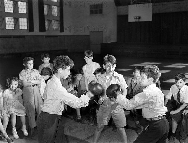 Boys Boxing match in gymnasium of community center