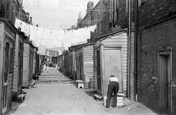 Narrow alley with hanging laundry