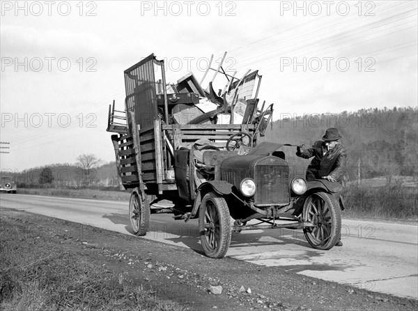 Tenant farmer moving his household goods to new farm