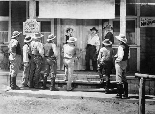 Victor McLaglen (at door