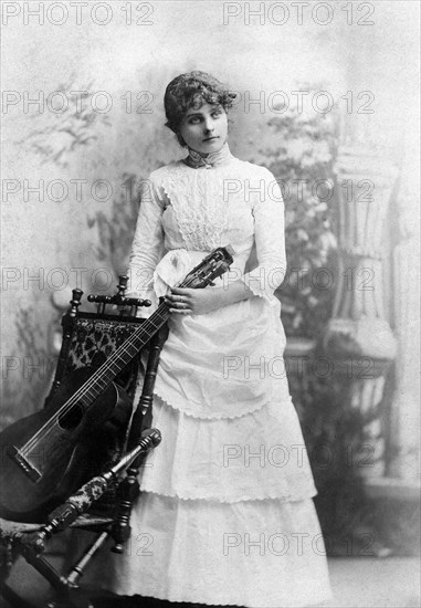 Young Adult Woman with Acoustic Guitar