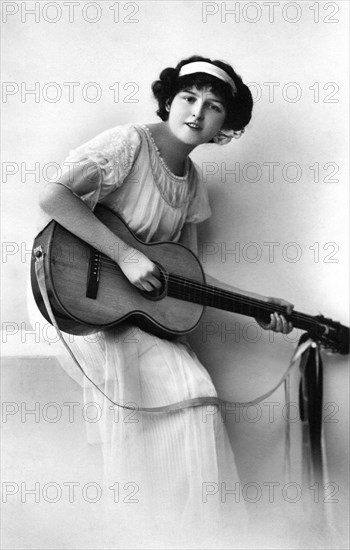 Young Adult Woman with Acoustic Guitar