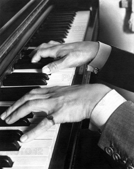 Hands playing Piano