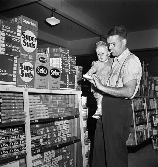 Father with infant son shopping