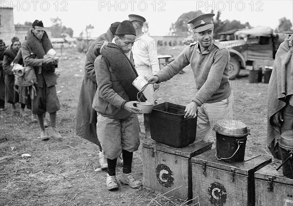 Italian prisoners of war being fed after detraining at Wadi al-Sarar Railway Station