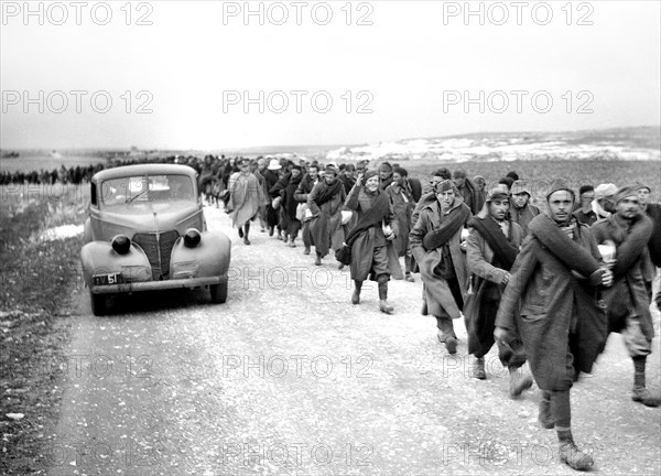 Italian prisoners of war walking along road after detraining at Wadi al-Sarar Railway Station