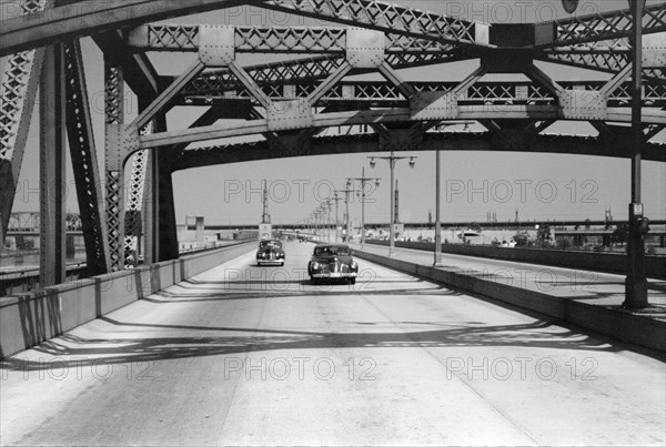 Cars traveling on parkway to Tri-borough bridge