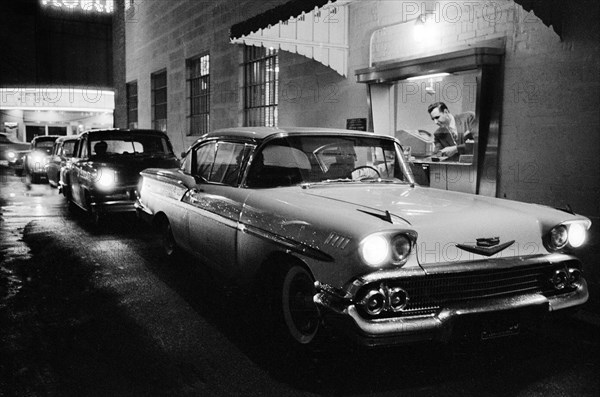 Cars lined up at suburban bank drive-thru window