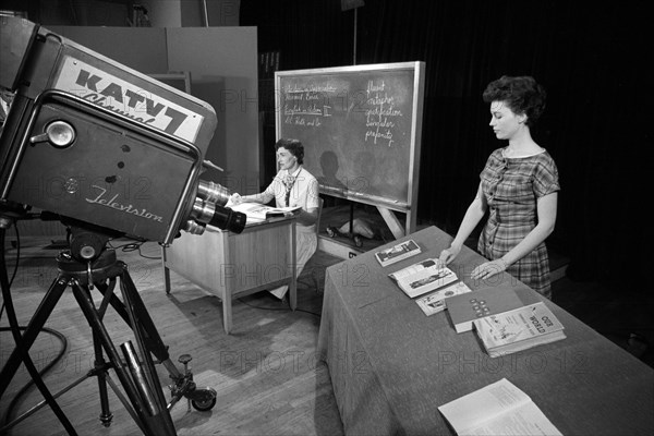 Two teachers teaching a class being broadcast by KATV 7 television