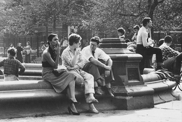 Group of people gathered around fountain