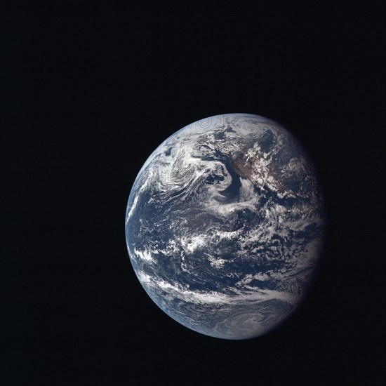 View of Earth taken by Apollo 11 crewmember during its trans-lunar coast toward the moon