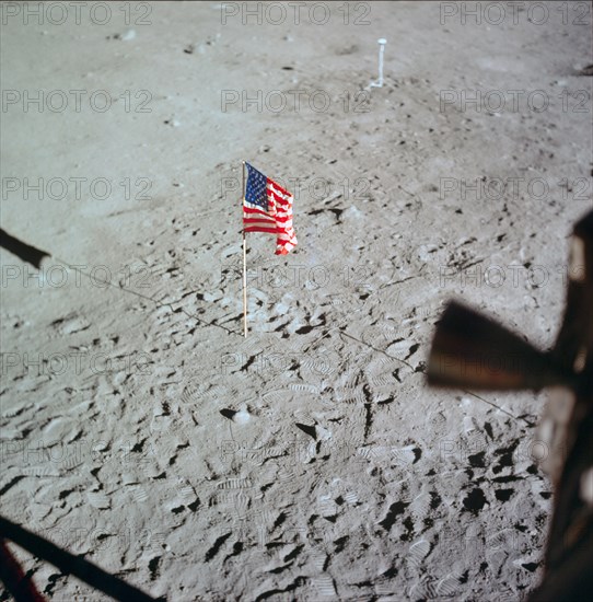 U.S. flag deployed on moon surface surrounded by footprints of astronauts Neil A. Armstrong and Edwin E. Aldrin Jr.