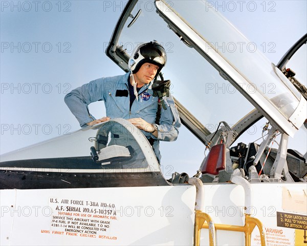 Apollo 11 mission commander Neil A. Armstrong climbing out of T-38 jet upon his arrival at Patrick Air Force Base in preparation of first manned lunar landing mission