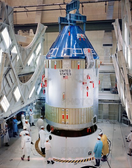 Apollo Spacecraft 101 Command/Service Modules being moved into position for mating with Spacecraft Lunar Module Adapter (SLA)-5