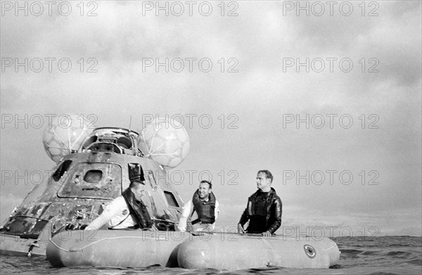 American Astronauts James A. Lovell Jr. (center)