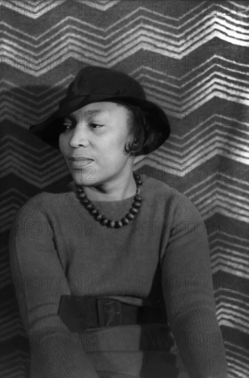 Zora Neale Hurston, American author, anthropologist, playwright, and filmmaker, who was active in the Harlem Renaissance, head and shoulders portrait, Carl Van Vechten, April 1938