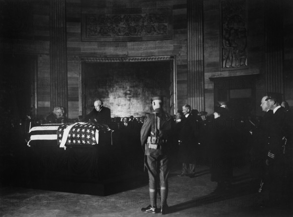 U.S. President Warren G. Harding placing wreath of flowers on casket of Unknown Soldier in rotunda of the Capitol, Washington, D.C., USA, U.S. Army Signal Corps, November 9, 1921