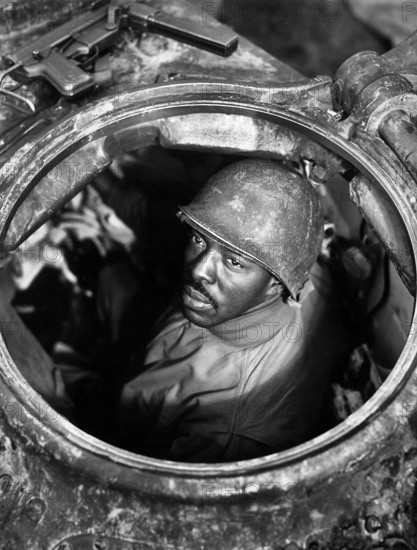 U.S. Corporal Carlton Chapman, machine-gunner in M-4 tank, attached to motor transport unit, near Nancy, France, U.S. Army Signal Corps, November 5, 1944