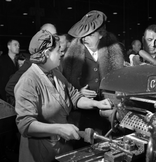 U.S. First Lady Eleanor Roosevelt talking with woman machinist during her goodwill tour of Great Britain, Toni Frissell, November 1942