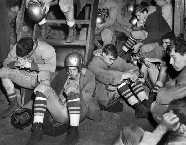 Gloomy high school football team in locker room during halftime, Freeport, New York, USA, Walter Albertin, New York World-Telegram and the Sun Newspaper Photograph Collection, 1950