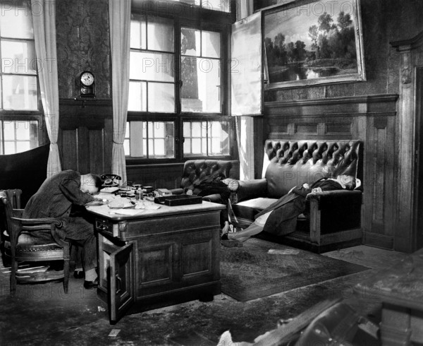 Burgomeister in his office with wife and daughter after they committed suicide as U.S. 69th Infantry Division and 9th Armored Division closed in on city, Leipzig, Germany, U.S. Army Signal Corps, April 20, 1945