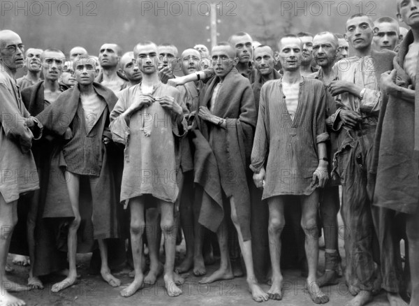 Starved prisoners nearly dead from hunger in concentration camp, which was reputedly used for "scientific" experiments, posing after It was liberated by U.S. 80th Division, Ebensee, Austria, U.S. Army Signal Corps, May 7, 1945