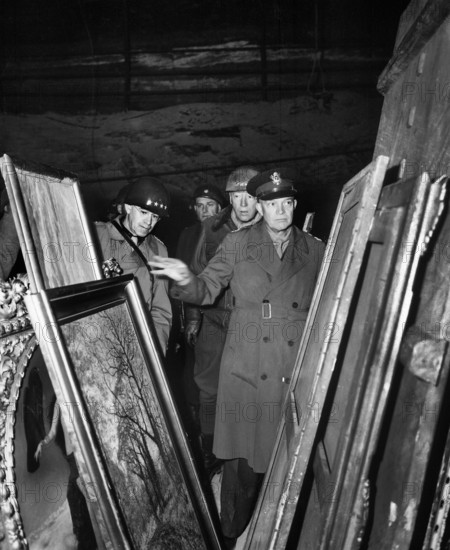U.S. General Dwight D. Eisenhower, Supreme Allied Commander, accompanied by General Omar N. Bradley, and Lieutenant General George S. Patton, Jr., inspecting art treasures stolen by Germans and hidden in salt mine, Germany, U.S. Army Signal Corps, April 12, 1945