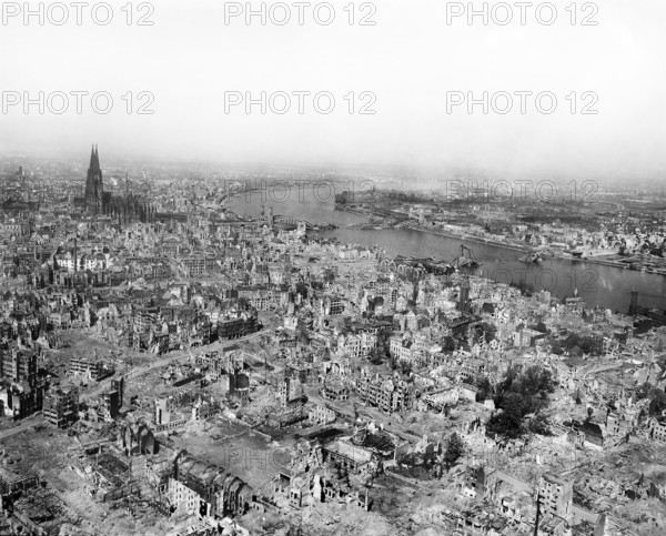 Cologne Cathedral standing undamaged while entire area surrounding it is completely devastated with railroad station and Hohenzollern Bridge lying damaged to the north and east of the cathedral, Cologne, Germany, U.S. Army Signal Corps, April 24, 1945