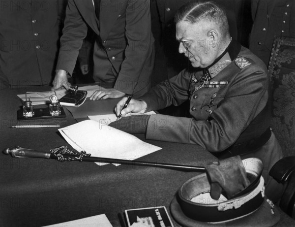German Field Marshal Wilhelm Keitel, signing ratified surrender terms for the German Army at Russian Headquarters, Berlin, Germany, U.S. Army Signal Corps, May 7, 1945