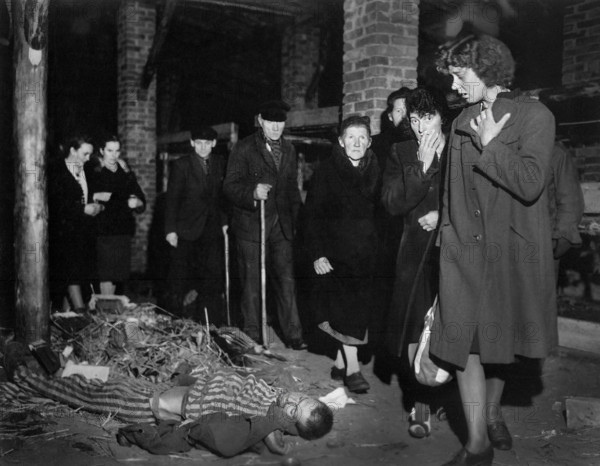 German citizens, under orders of the U.S. 82nd Airborne Division, inspecting nearby concentration camp, Ludwigslust, Germany, U.S. Army Signal Corps, May 6, 1945