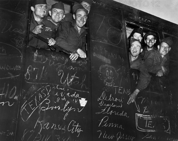 Happy veterans heading for harbor of Le Havre, France, the first to be sent home and discharged under U.S. Army's new point system, U.S. Army Signal Corps, May 25, 1945