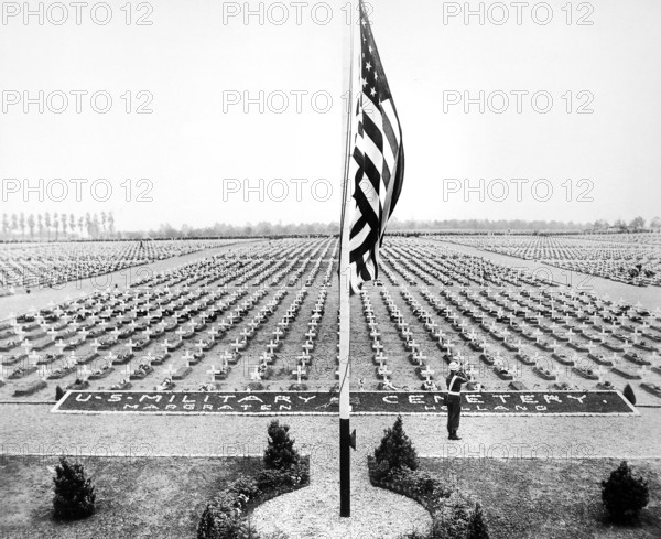 American bugler blowing taps at close of Memorial Day service at Margraten Cemetery, Holland, where lie thousands of American heroes of World War II, U.S. Army Signal Corps, April 30, 1945
