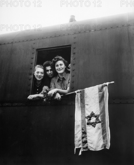 Three Jewish children are on their way to Palestine after having been released from Buchenwald Concentration Camp, Germany, U.S. Army Signal Corps, June 5, 1945