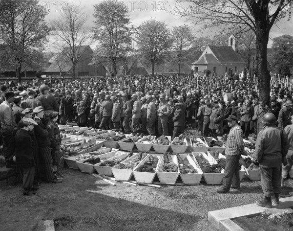 Chaplains of U.S. Third Army conducting burial services for 120 Russian and Polish Jews, victims of SS troopers' killing in a wood near Neunburg, Bavaria, Germany, U.S. Army Signal Corps, April 29, 1945
