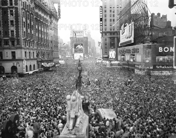 Crowds gather in Times Square to celebrate the surrender of Japan, V-J Day, New York City, New York, USA, U.S. Army Signal Corps, August 15, 1945